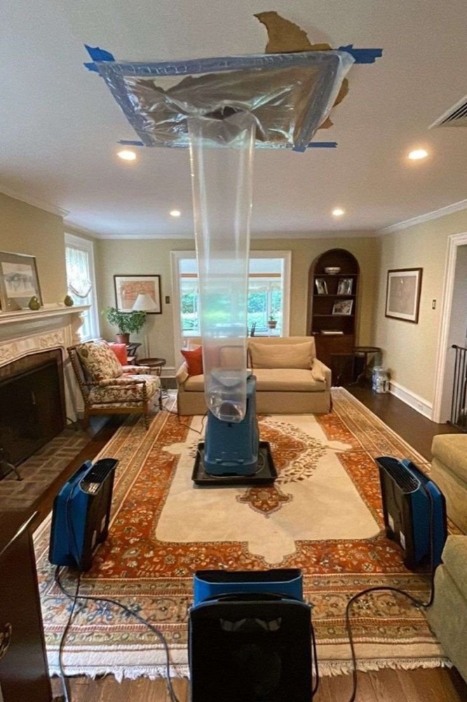 Containment and drying equipment set up in a living room